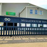 Industrial sliding gate with laser cut logo sign