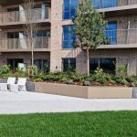 Wide planter edging to double as a simple seating solution