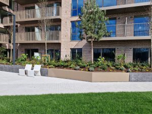 Wide planter edging to double as a simple seating solution