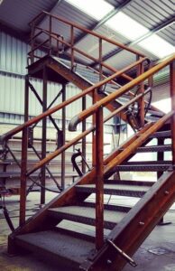 External industrial stairs in production, assembled for quality checks before galvanising